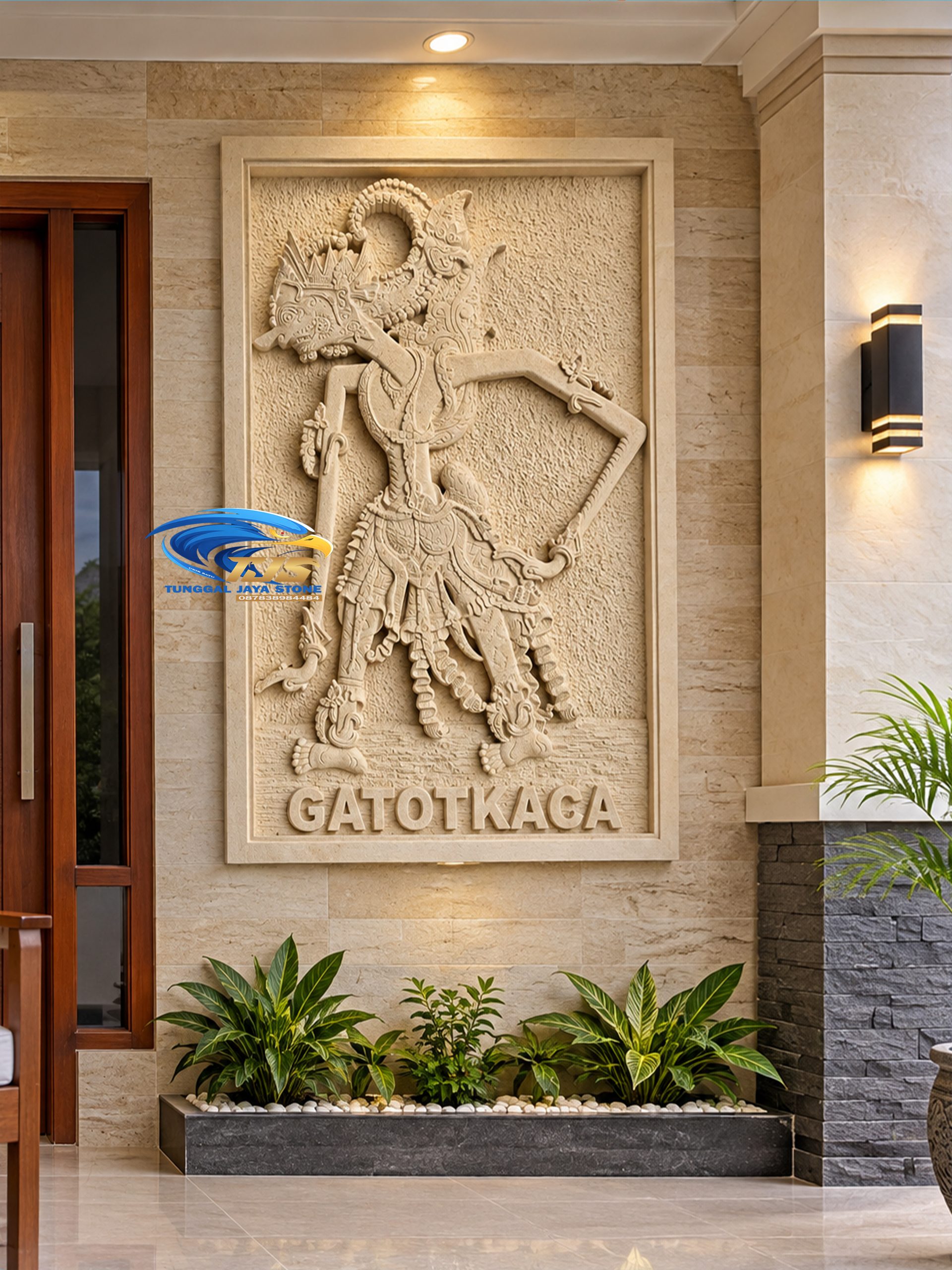 Ornamen hiasan dinding relief Gatotkaca pada fasad rumah mewah