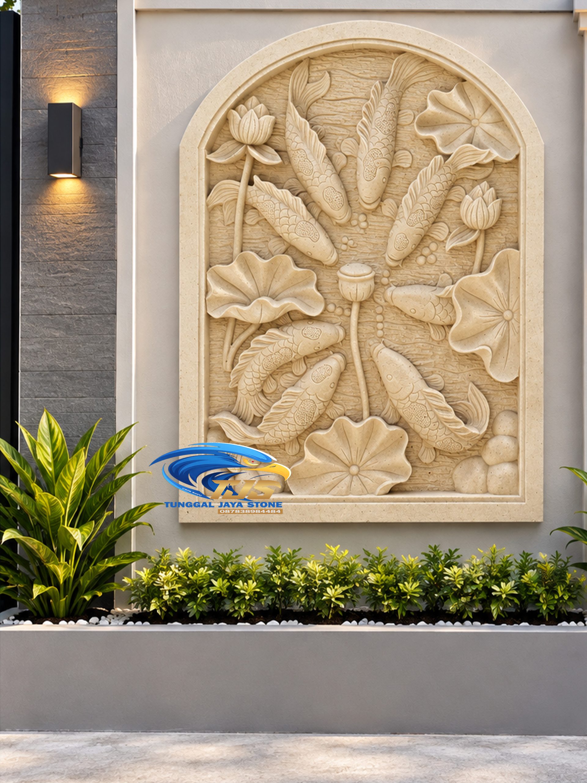 Ornamen batu alam relief ikan koi dan bunga teratai pada dinding pagar rumah modern